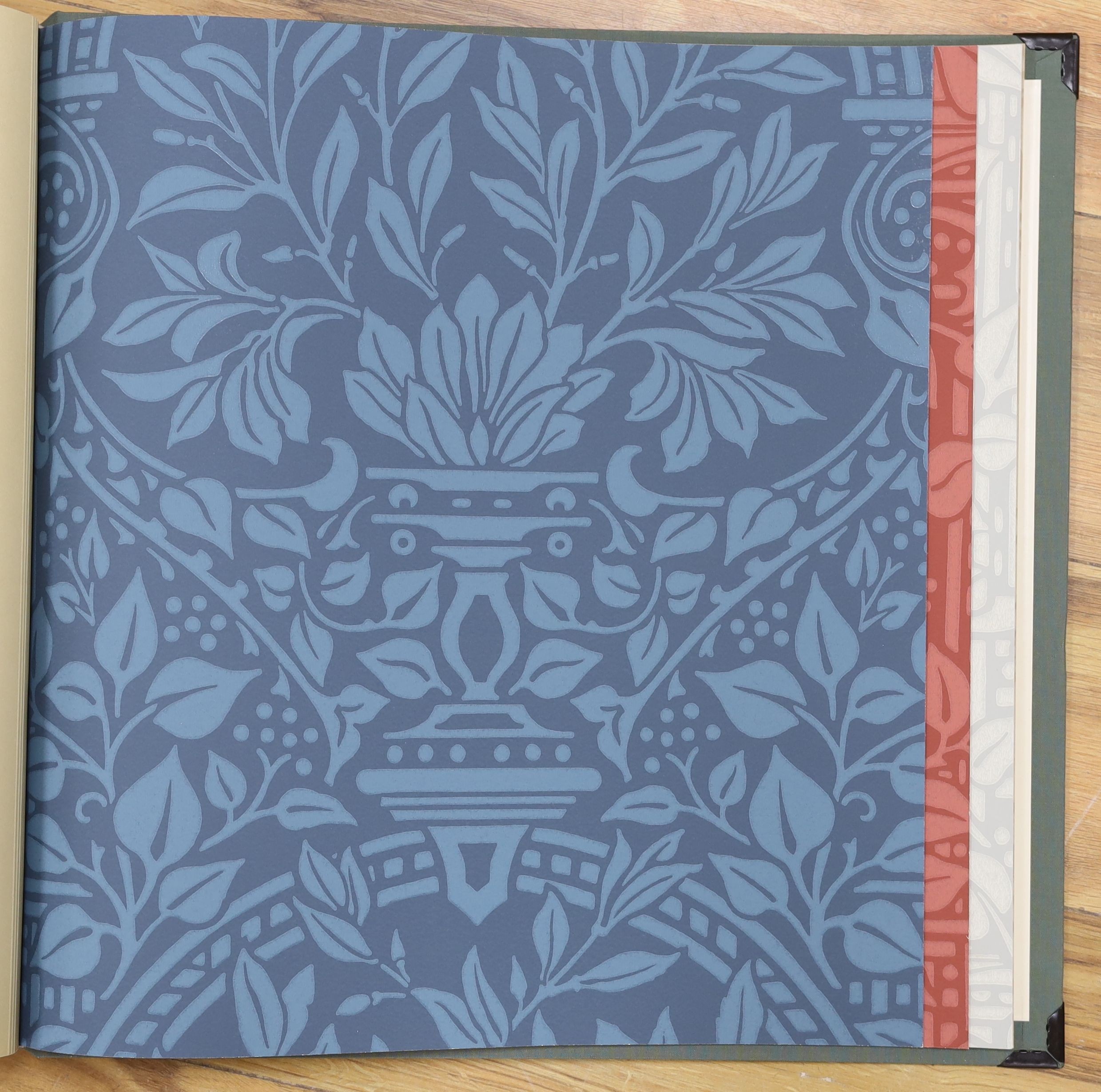 A contemporary William Morris & Co. archive wallpaper pattern book celebrating 150 years of Morris and Co. Design, together with G.P. & J Baker linen pattern book (2)